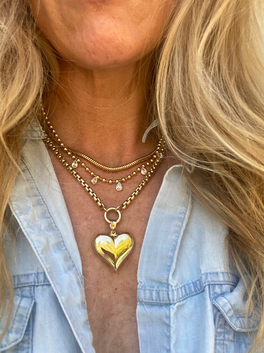 Large puffed heart (gold teething heart).